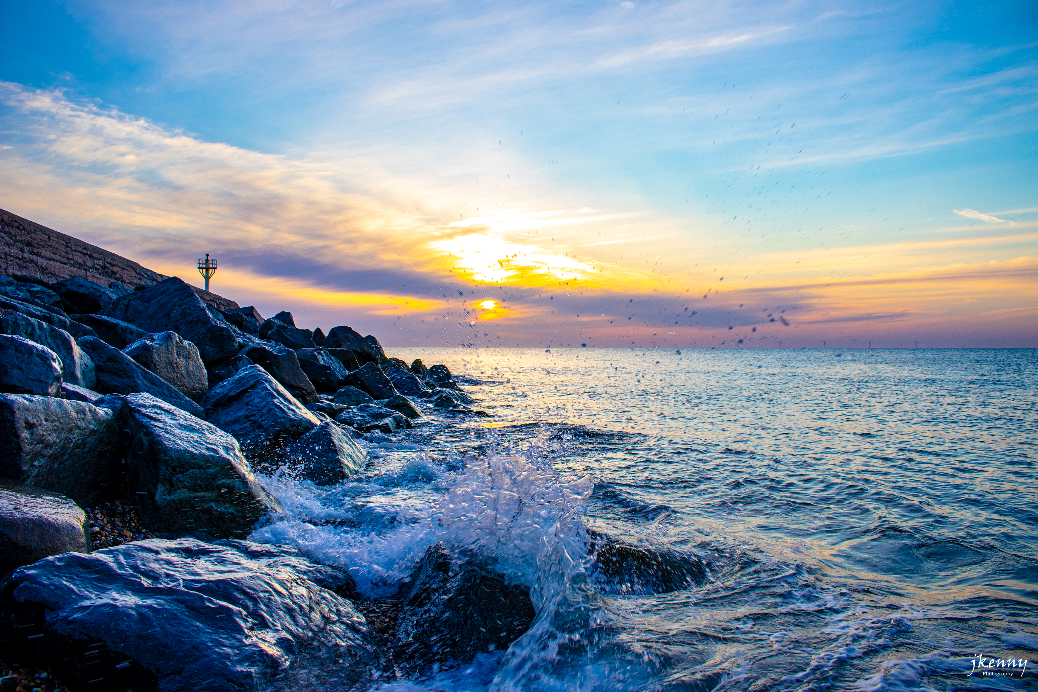 Waves rolling of rocks at Arklow South Pier.