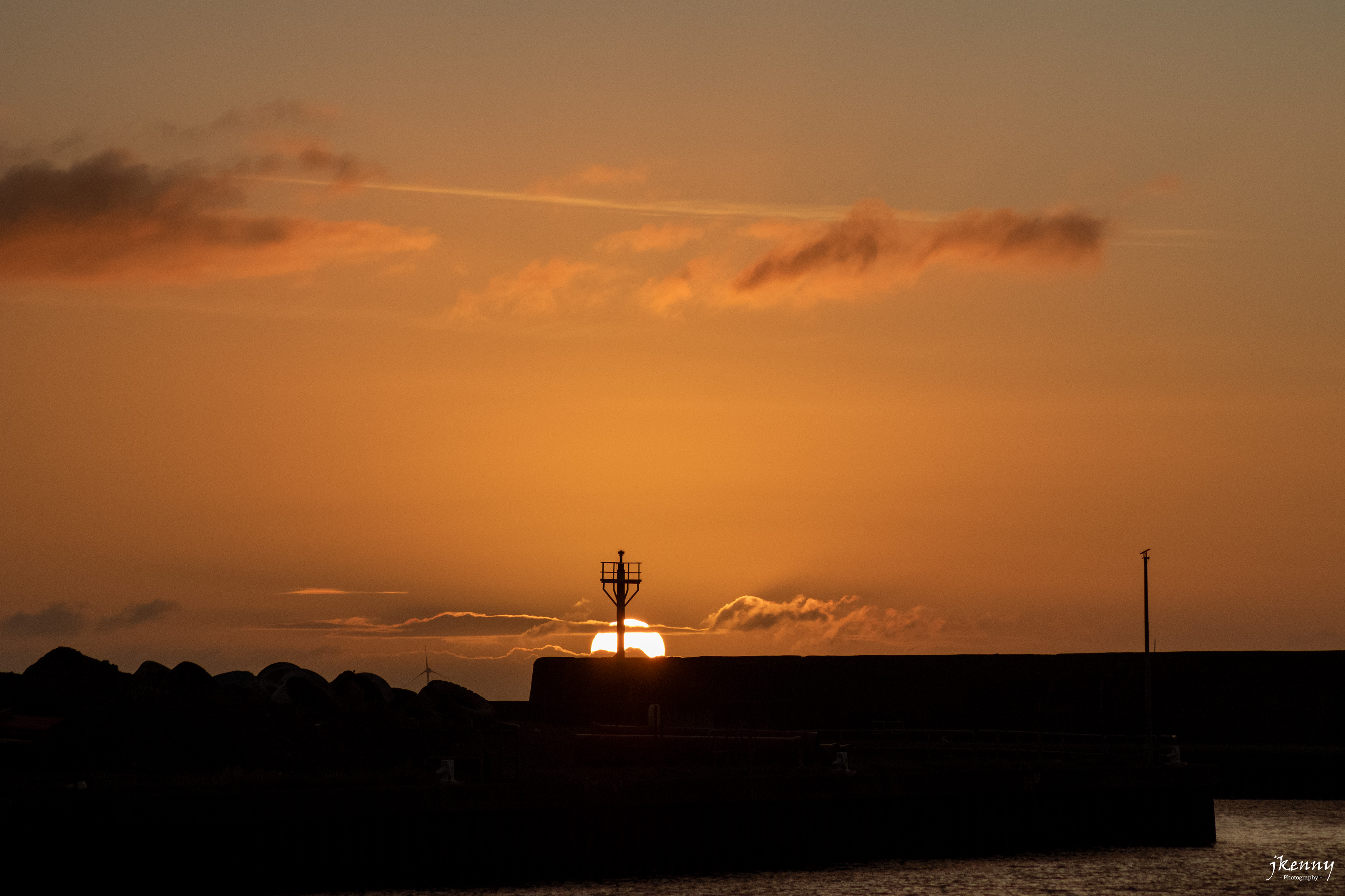 Sunrise behind the pier.